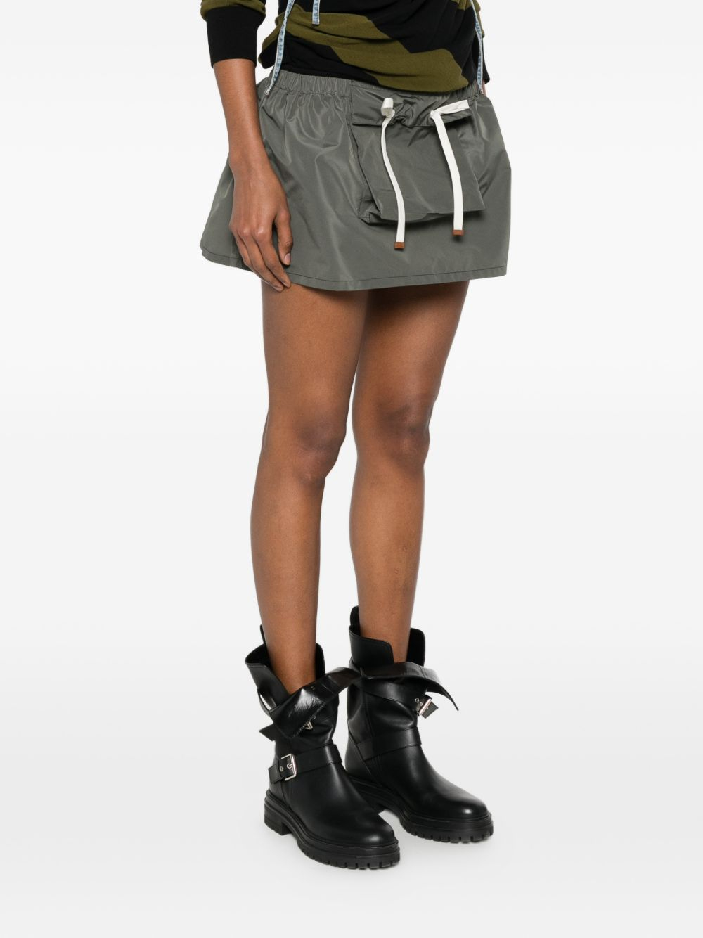 [Miu Miu] Mini skirt FW26 MG2704121IF0414