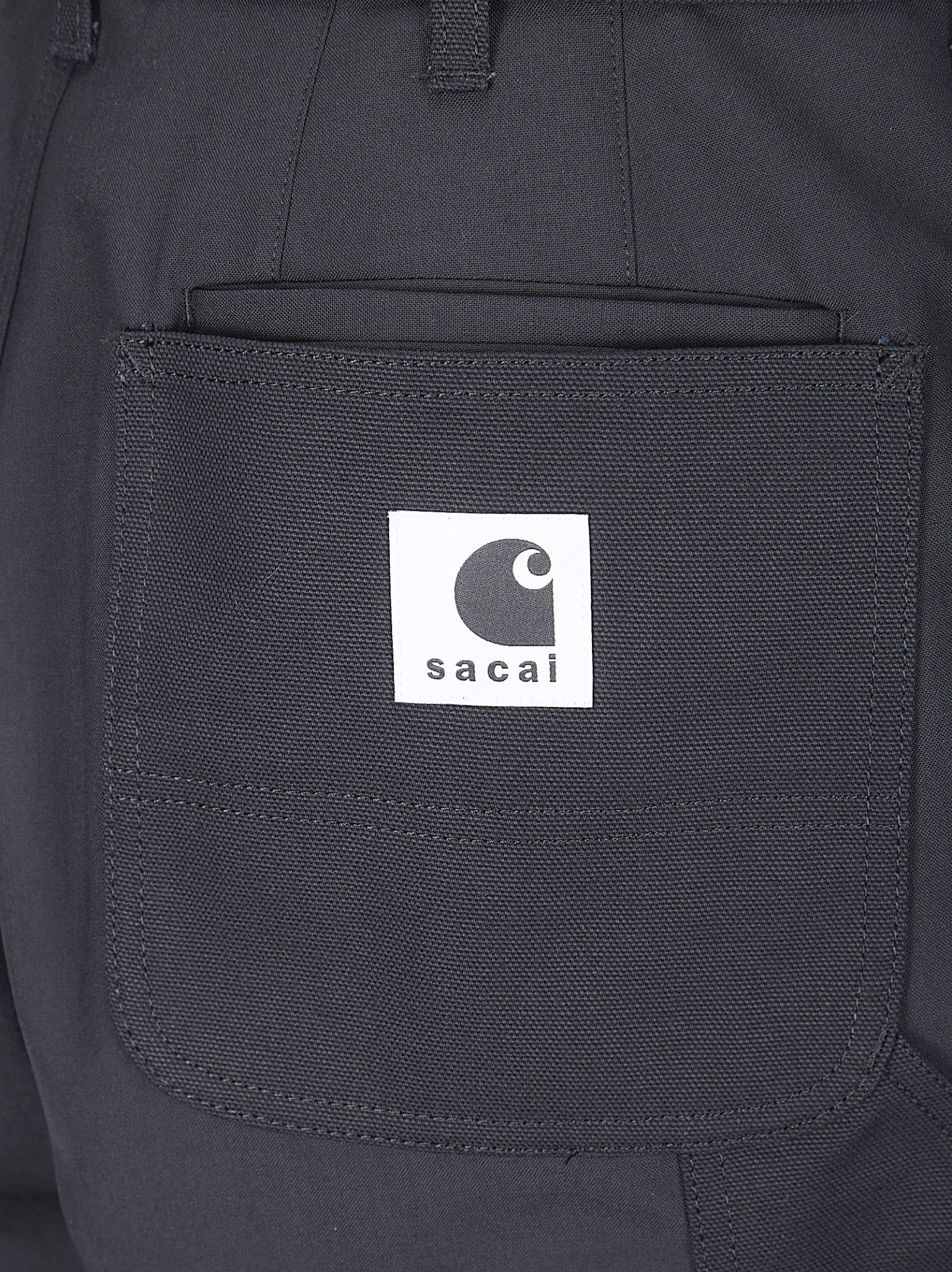 [Sacai X Carhartt] Trousers SS26 2603993M 001